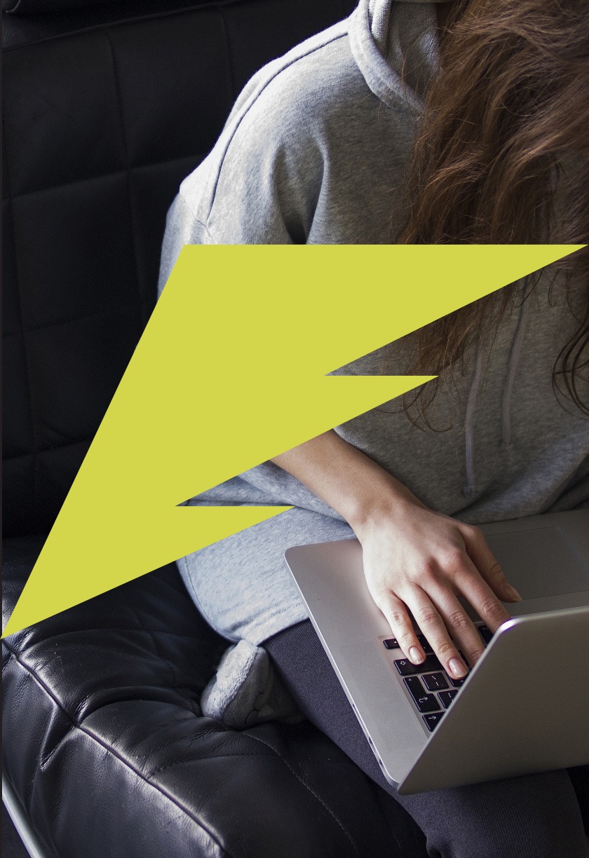 Stylized lightning bolt over woman typing at keyboard